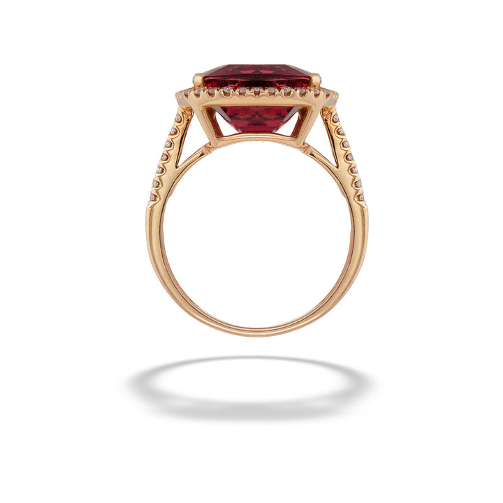 Rose gold ring with a red gemstone on a white background  18K Rose Gold Pink Tourmaline Halo Ring