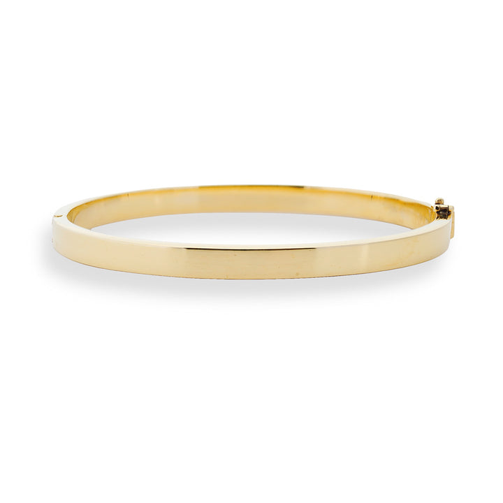 Gold bangle on a white background 18K Gold Hinged Bangle Bracelet