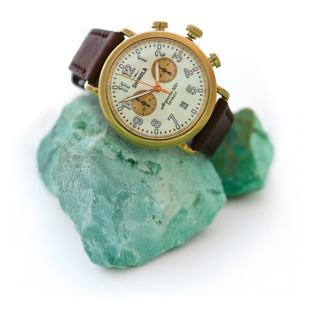 Shinola watch displayed on 2 pieces of turquoise