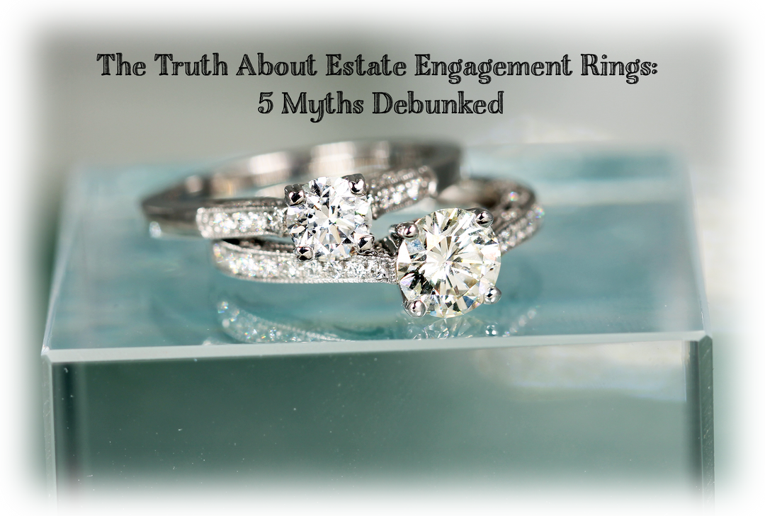 estate engagement rings stacked one on the other on glass