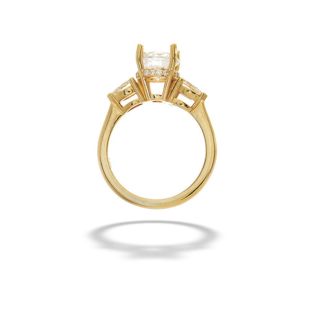 Gold ring with a diamond on a white background Diamond Hidden Halo Semi-Mount Ring with Pear Side Diamonds