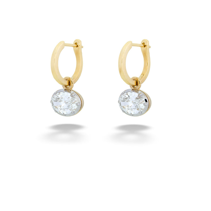 Gold hoop earrings with clear gemstones on a white background Oval Lab Grown Diamond Hoops by Miss Mimi