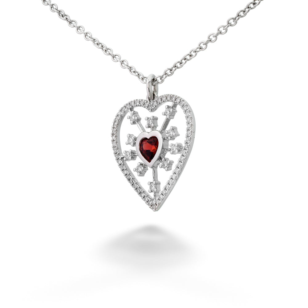 Heart-shaped pendant with a red gemstone on a white background Garnet Heart Pendant Necklace by Shy Creation