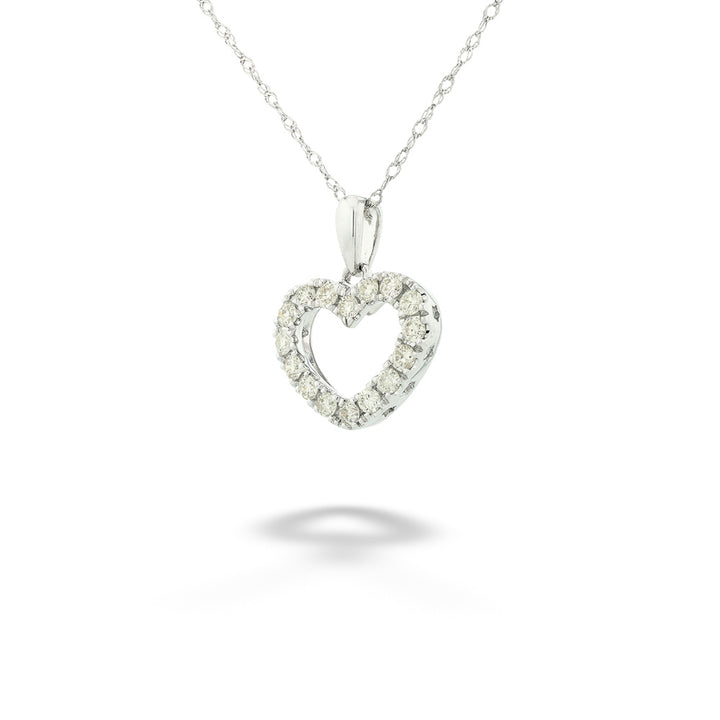Heart-shaped diamond pendant on a chain against a white background