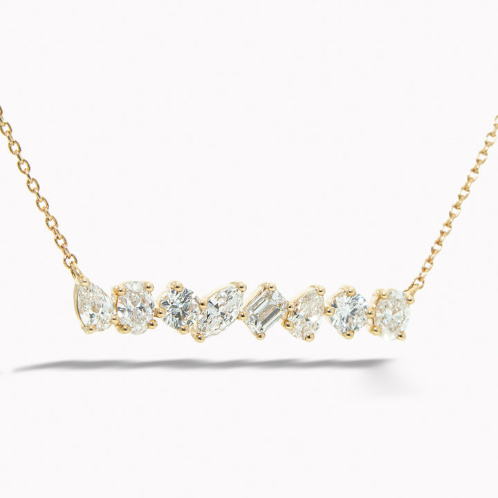 Gold necklace with diamond pendants on a white background Multi-Shape Diamond Bar Necklace