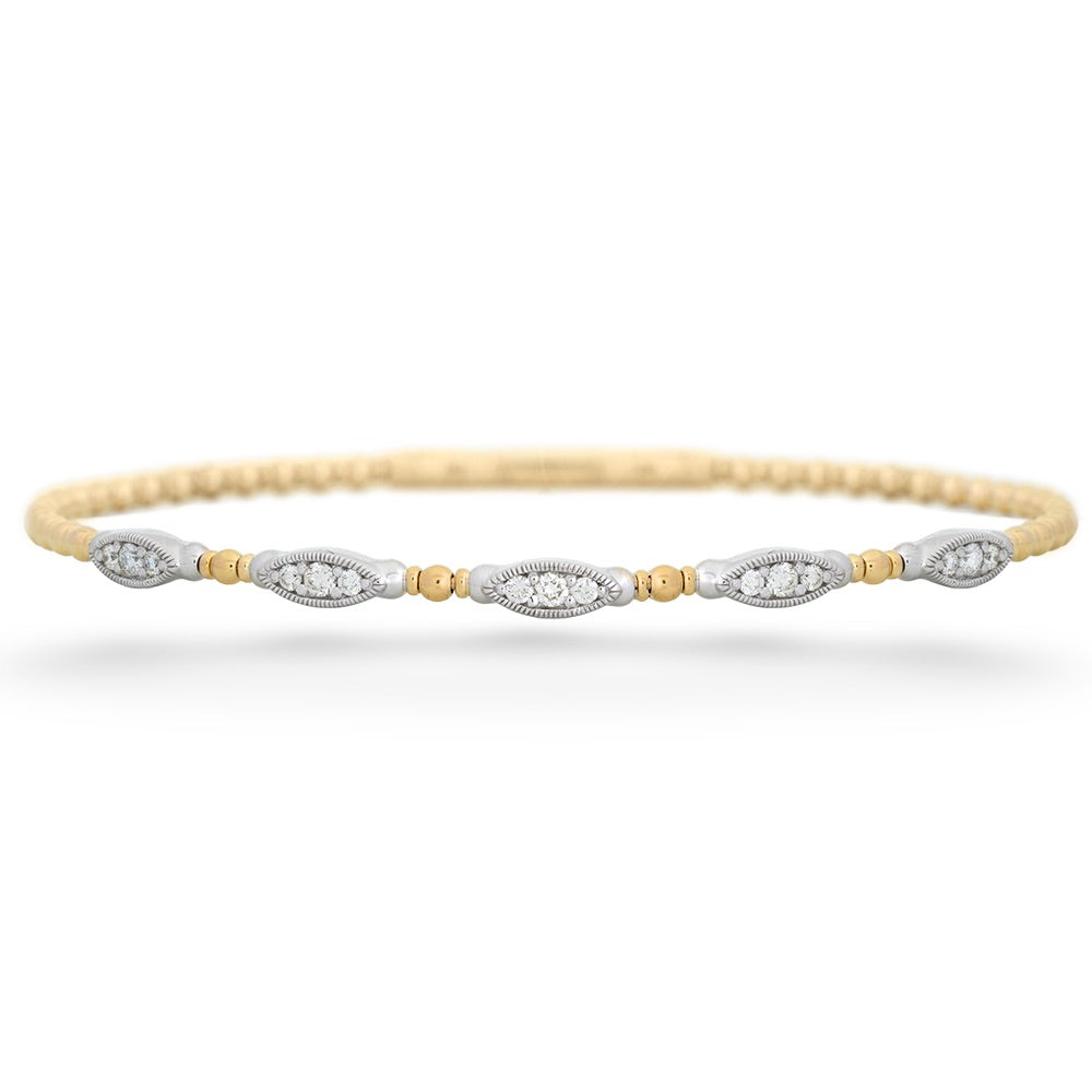 Delicate gold and silver bracelet on a white background Diamond Station Bangle