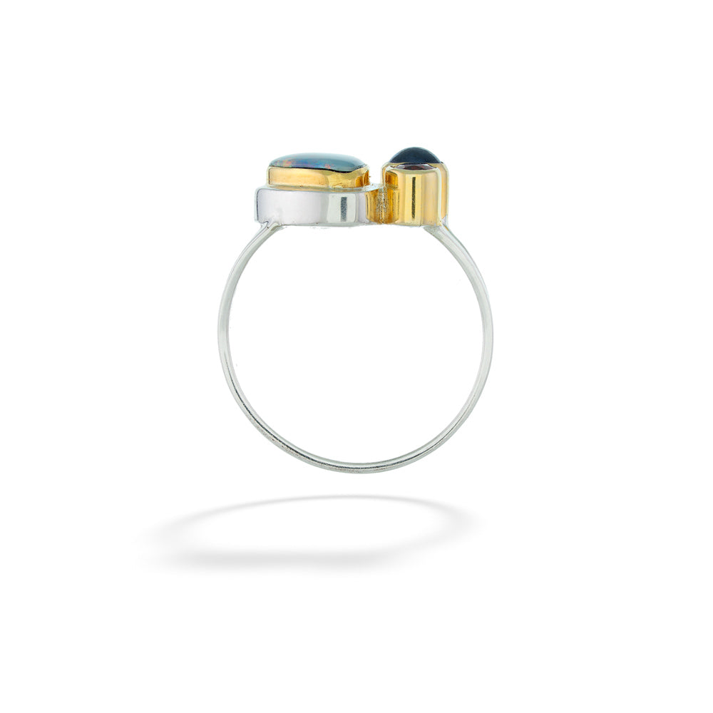 Silver ring with gold and black accents on a white background Opal, Kyanite, and Garnet Ring by Michou 
