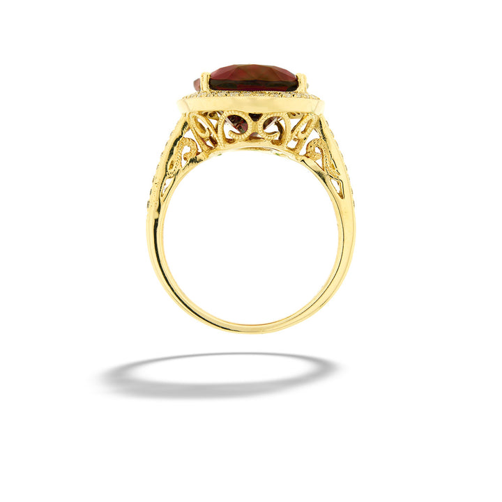 Gold ring with a red gemstone on a white background 14K Yellow Gold Rhodolite Garnet Halo Ring