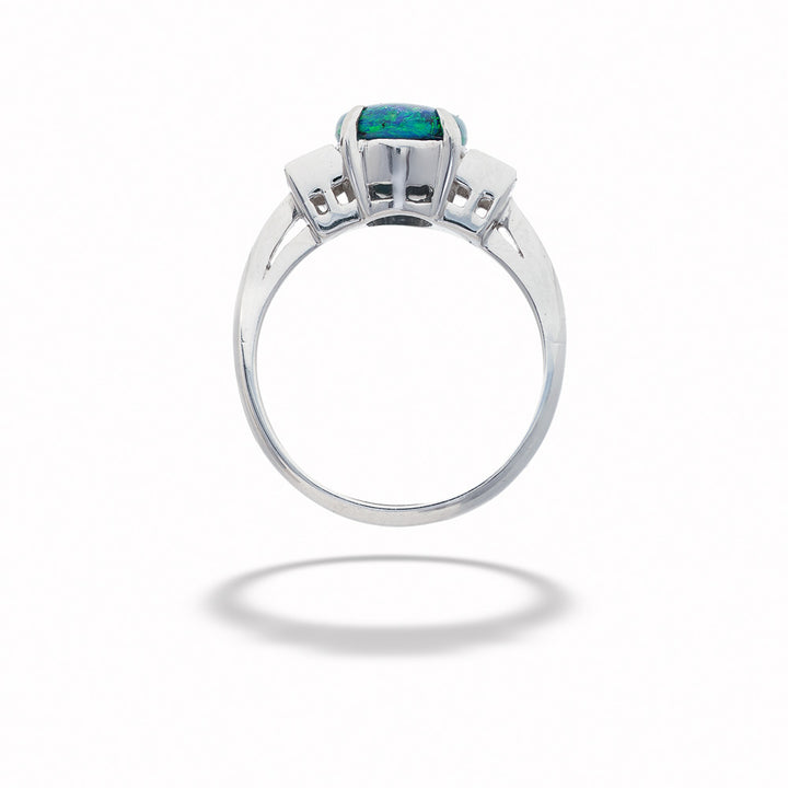 Silver ring with a green gemstone on a white background  Black Opal and Diamond Ring 