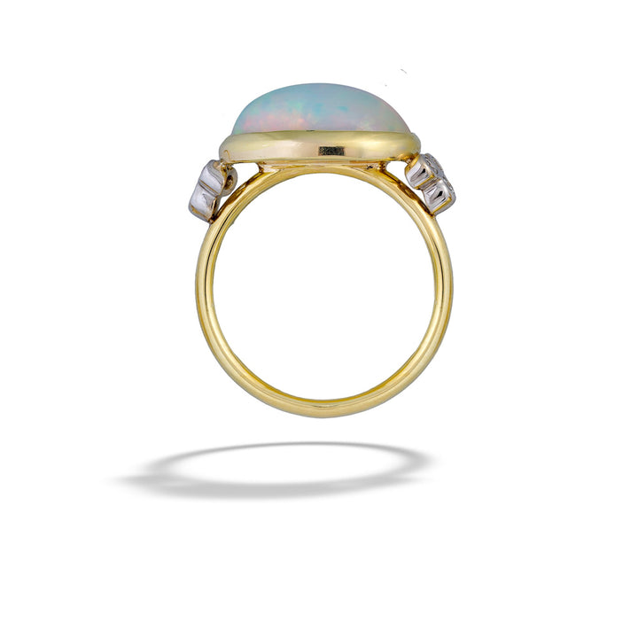 Gold ring with an opal stone and small diamonds on a white background  Opal and Diamond Capri Ring by Mazza 