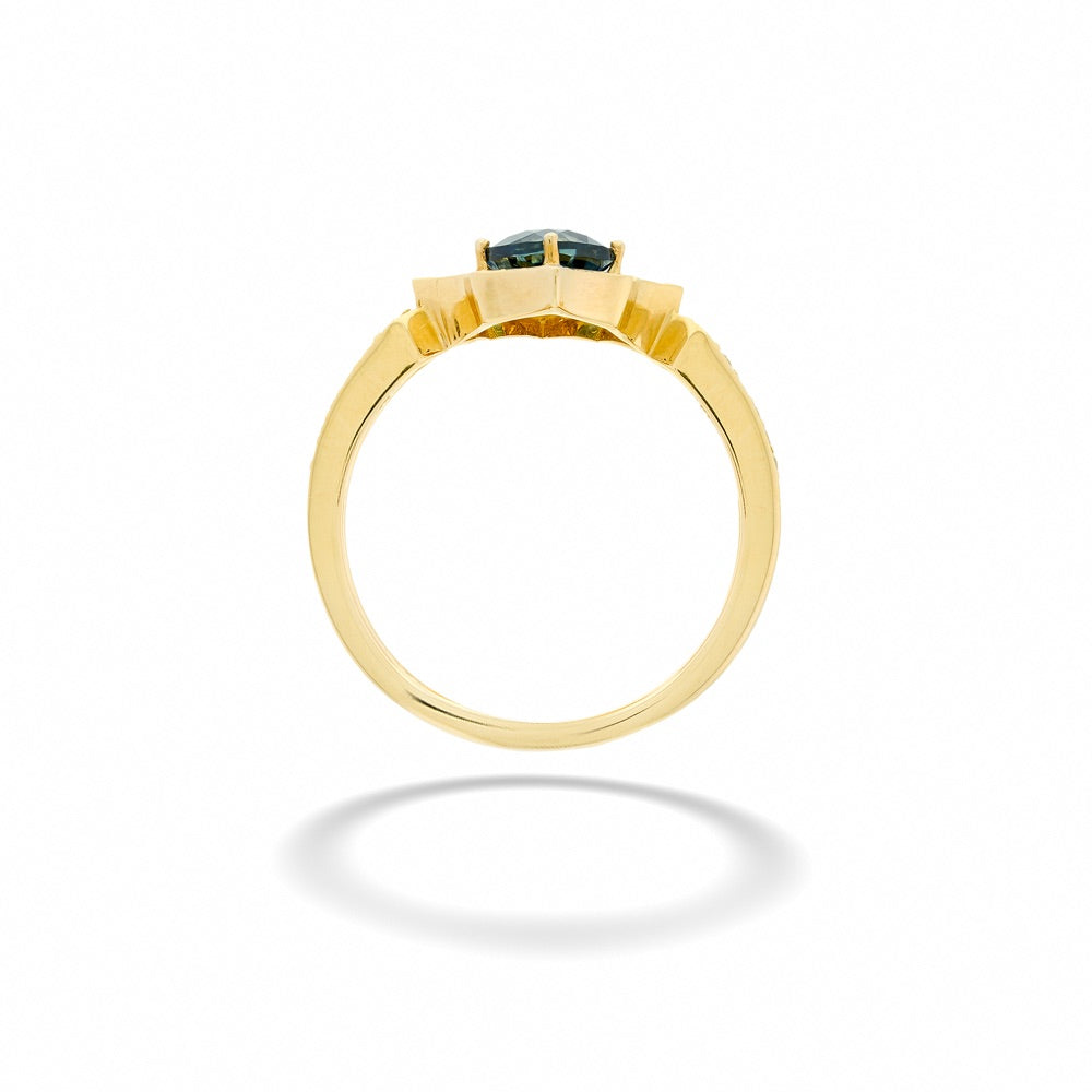 Gold ring with a central gemstone on a white background 14K Gold Montana Sapphire and Diamond Ring by Parle