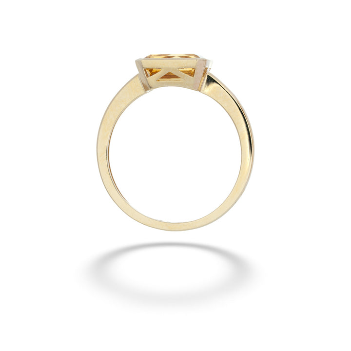 Gold ring with a central gemstone on a white background Citrine Ring by Shy Creation