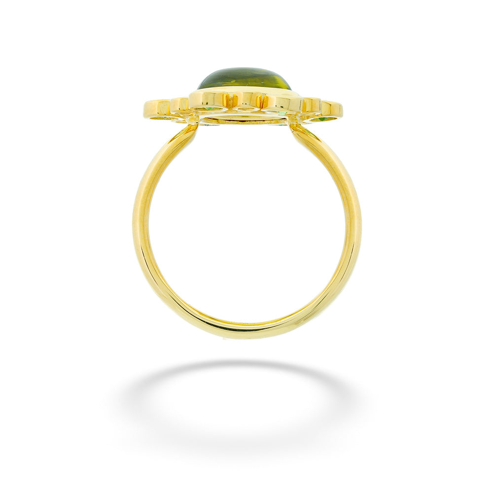 Gold ring with a green stone on a white background Peridot and Diamond Ring by Mazza