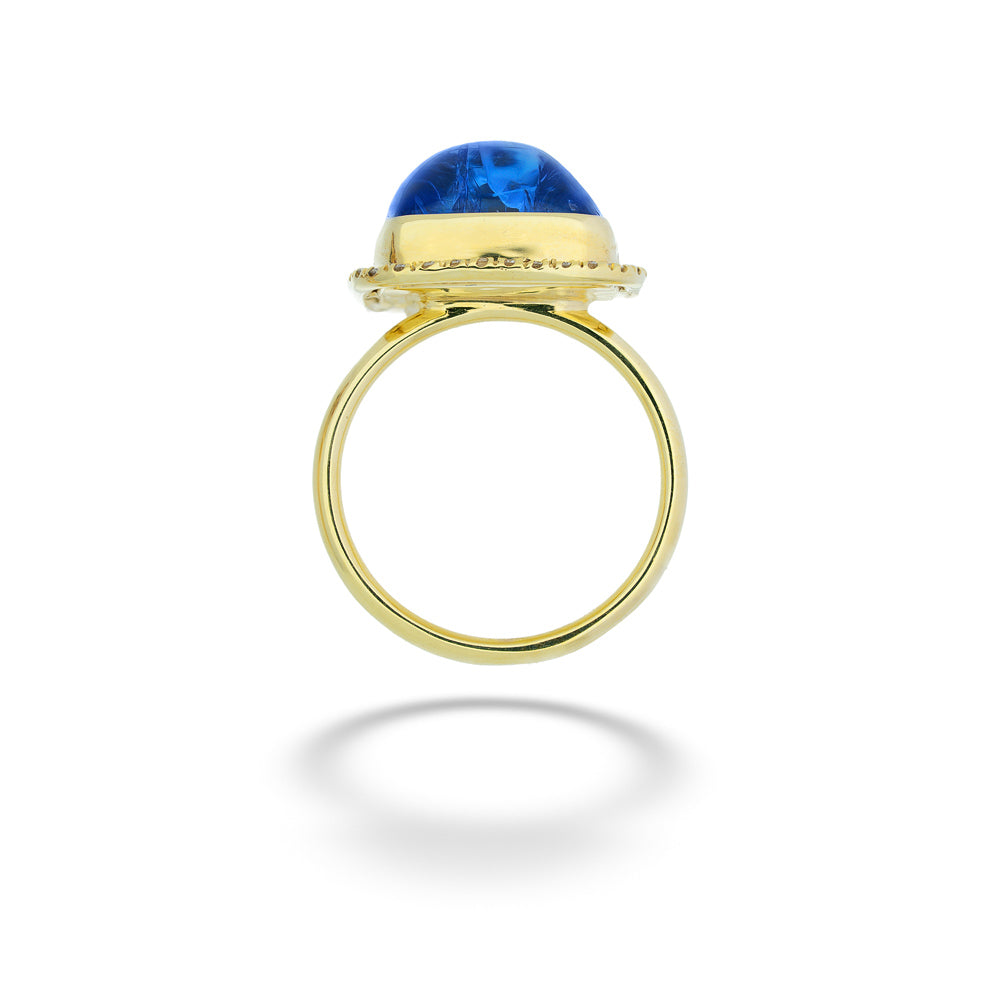 Gold ring with a blue gemstone on a white background Square Tanzanite and Diamond Halo Ring by Mazza