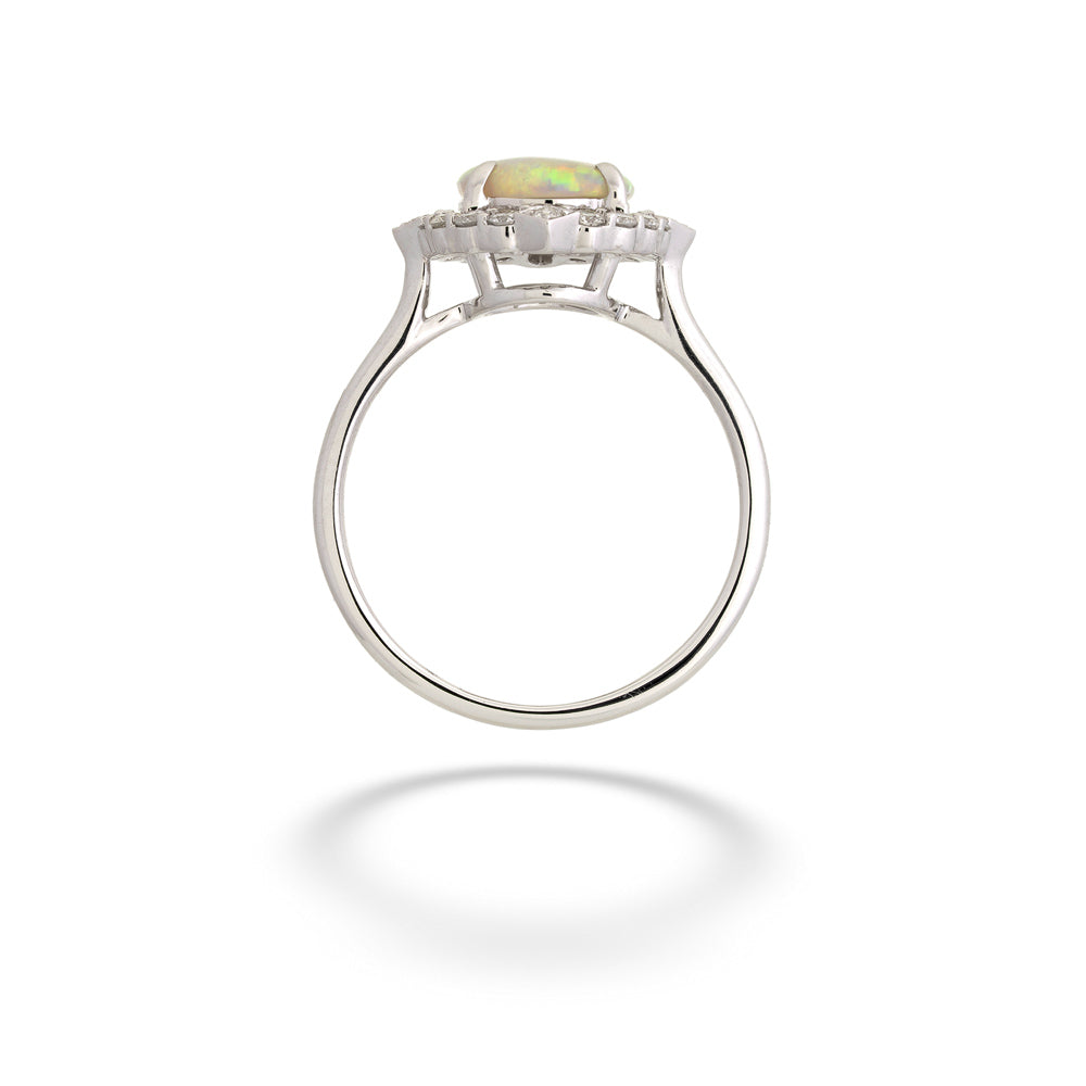 Silver ring with a green gemstone on a white background  14K White Gold Opal Ring with Diamond Halo 