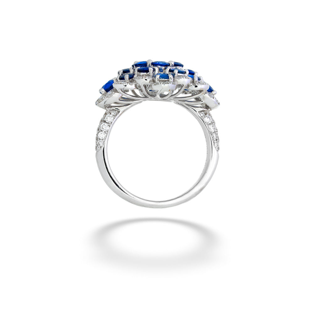 Silver ring with blue gemstones on a white background Blue Sapphire and Diamond Cocktail Ring