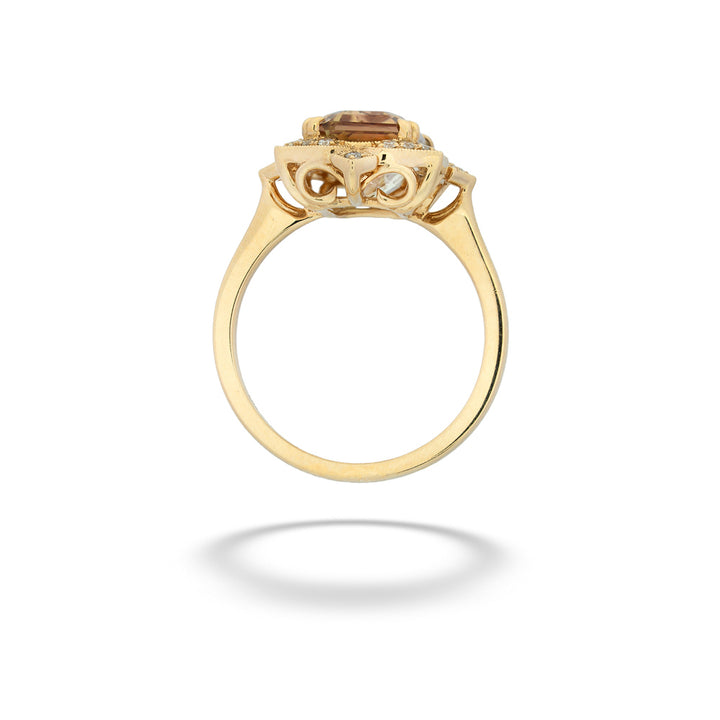 Gold ring with a central gemstone on a white background Watermelon Tourmaline and Diamond Ring