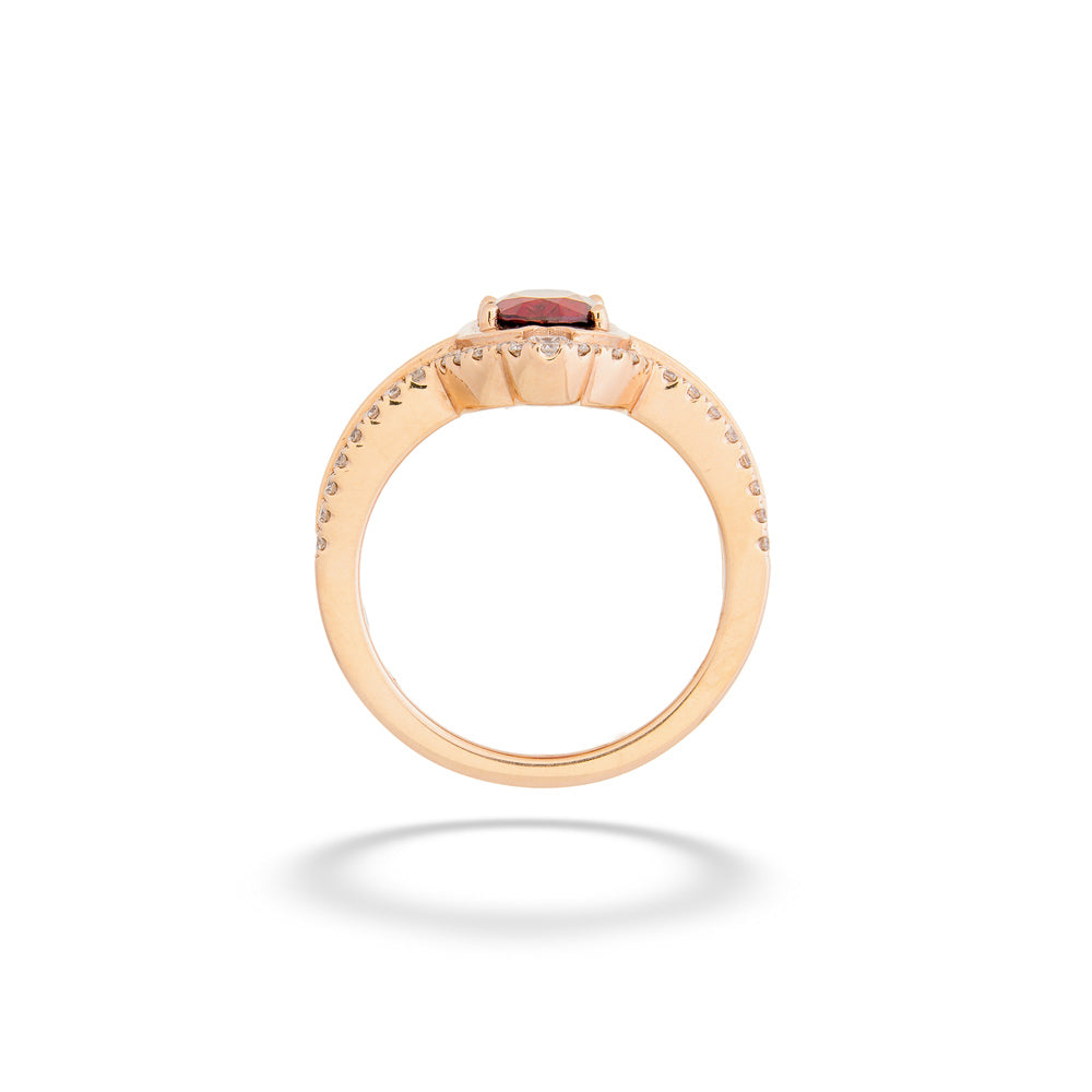 Rose gold ring with a central gemstone on a white background Red Spinel Rose Gold Ring 