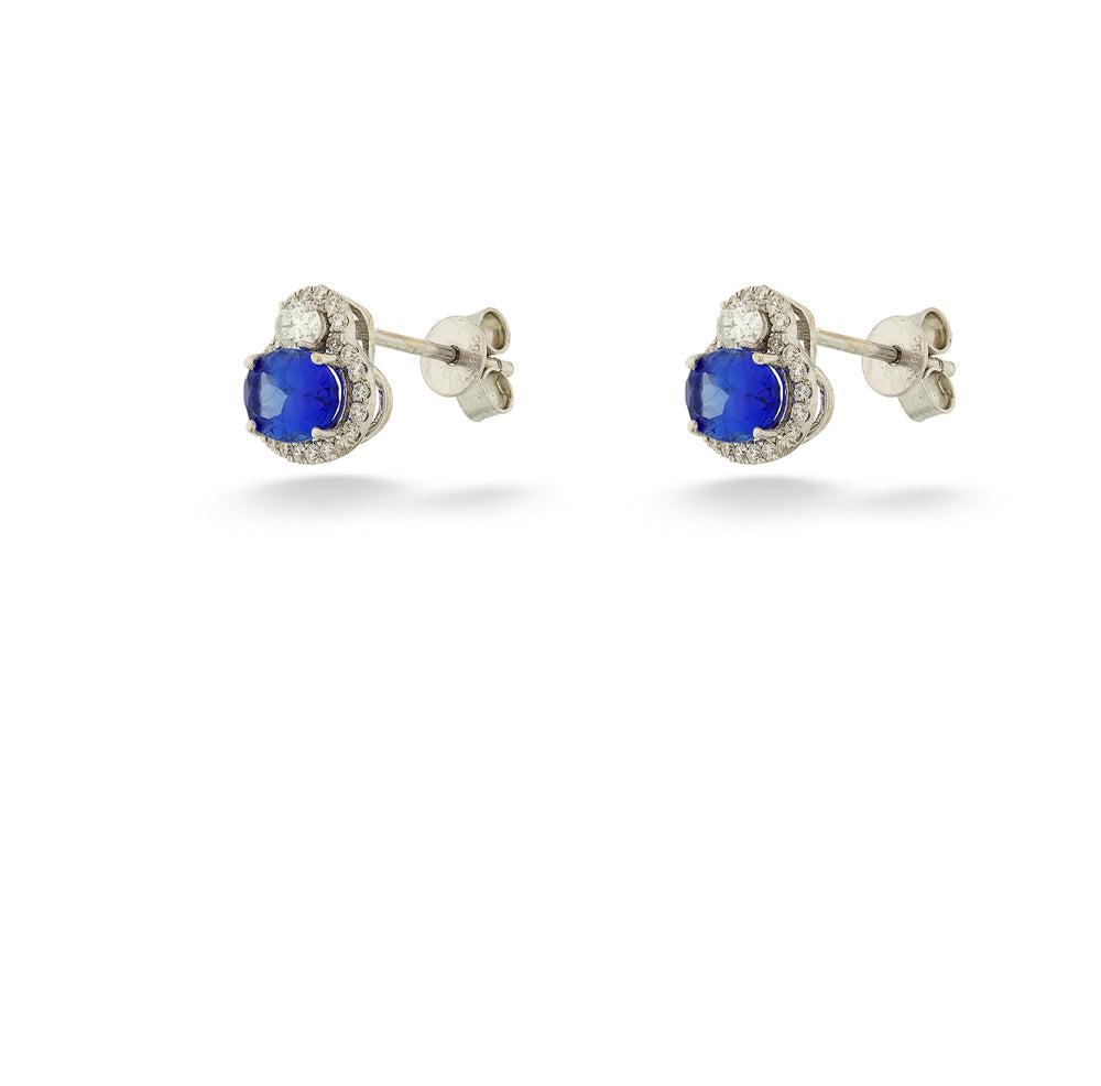 Pair of earrings with blue gemstones on a white background Tanzanite and Diamond Earrings by Parle