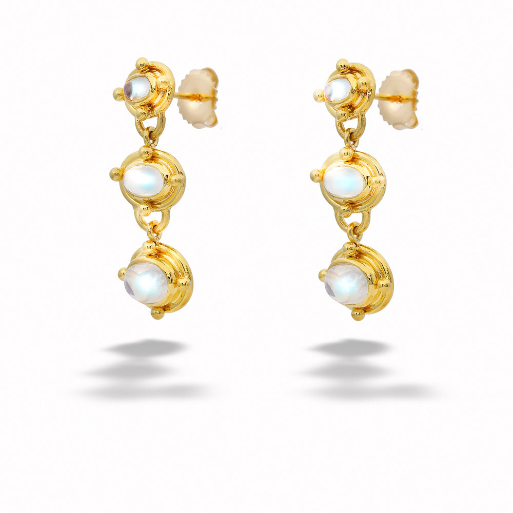 Gold earrings with white gemstones on a white background Triple Moonstone Dangle Earrings by Mazza