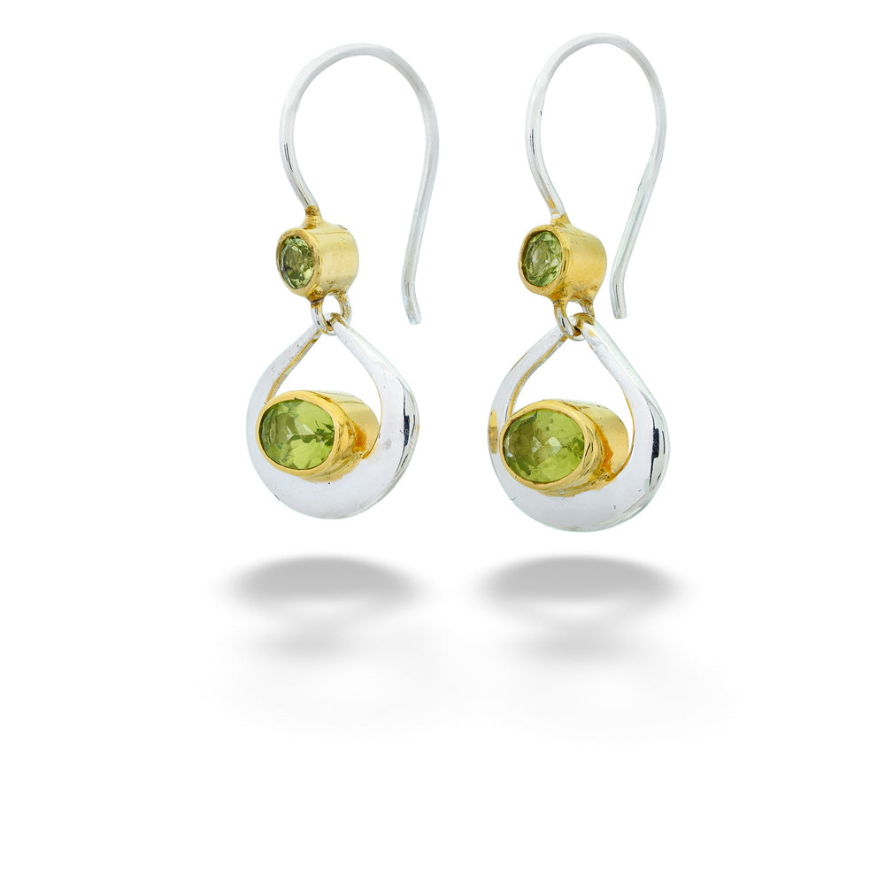 Pair of earrings with green gemstones on a white background Peridot Dangle Earrings by Michou