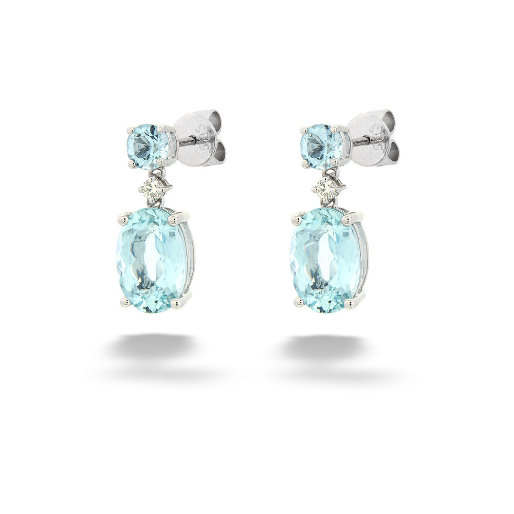 Pair of earrings with blue gemstones on a white background Aquamarine and Diamond Drop Earrings