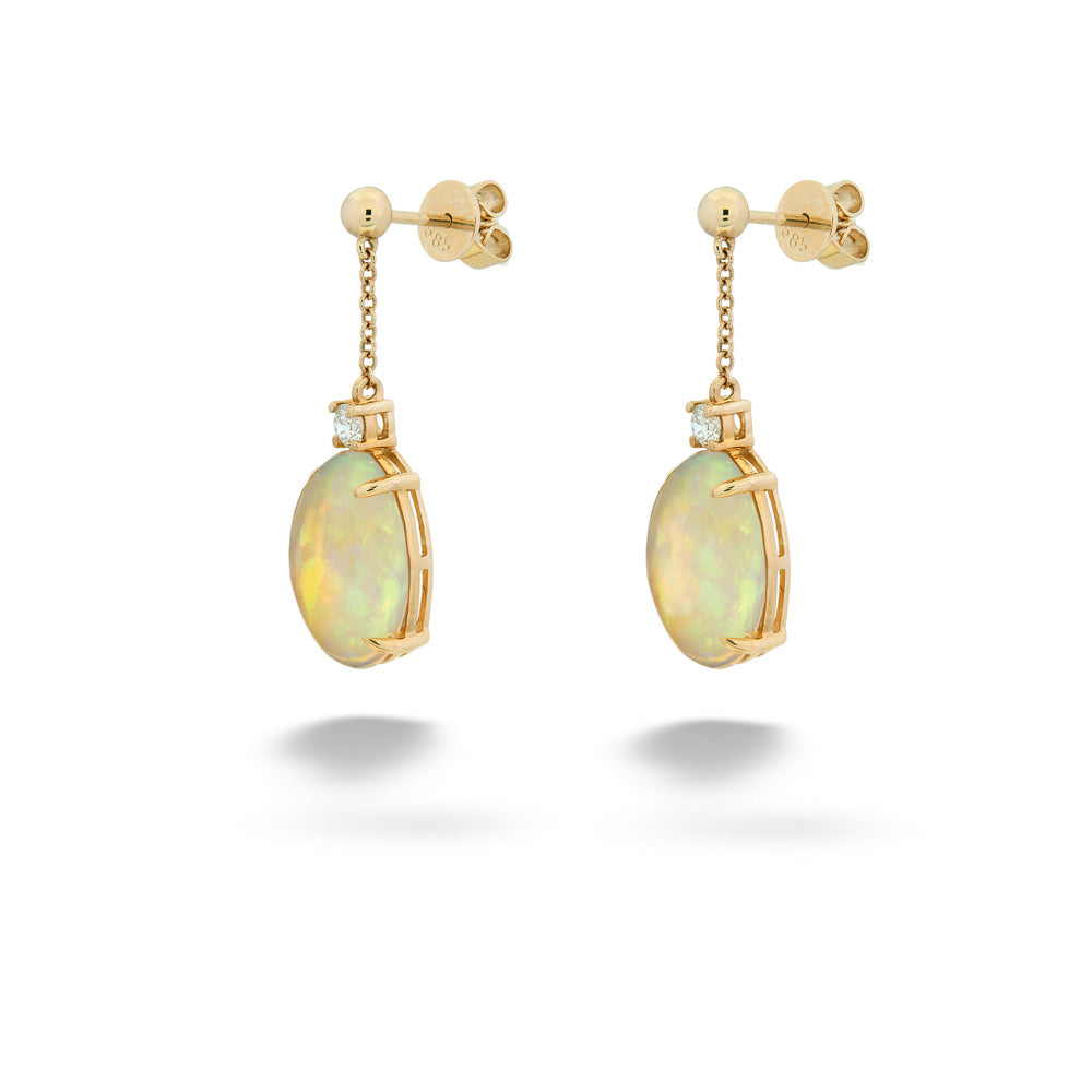 Gold earrings with opal stones on a white background Opal and Diamond Dangle Earrings