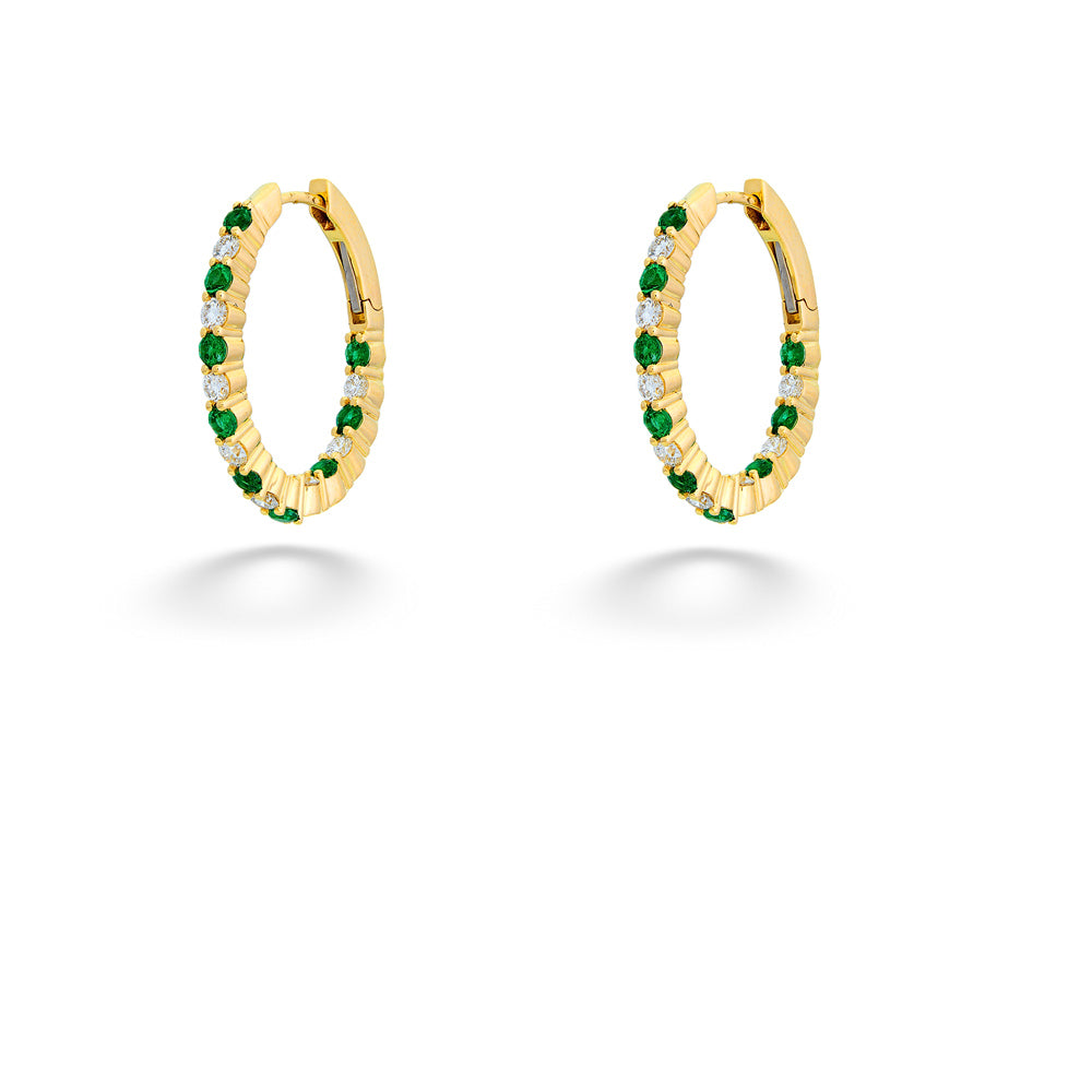 Gold hoop earrings with green gemstones on a white background Emerald and Diamond Inside-Out Hoops