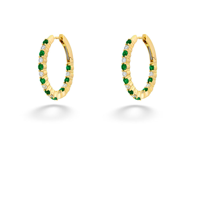 Gold hoop earrings with green gemstones on a white background Emerald and Diamond Inside-Out Hoops