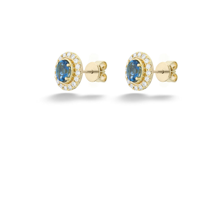 Gold earrings with blue gemstones on a white background Aquamarine Diamond Halo Stud Earrings