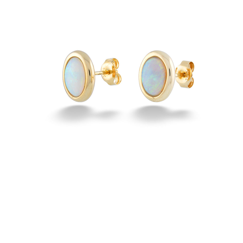 Gold earrings with opal stones on a white background Australian Opal Stud Earrings