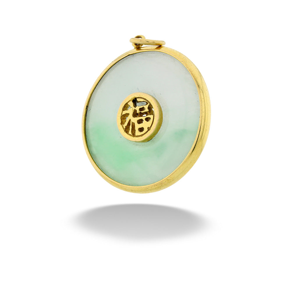 Round green jade pendant with gold frame and central emblem on a white background  Jade Circle Pendant by Mazza
