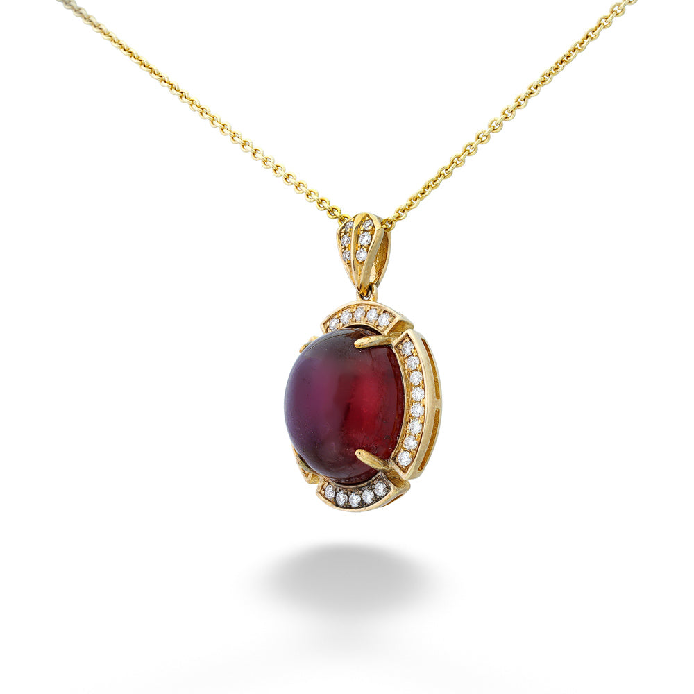 Gold necklace with a red gemstone pendant on a white background Hessonite Garnet and Diamond Halo Pendant Necklace