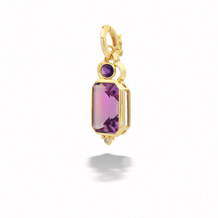 Gold pendant with a purple gemstone on a white background Amethyst and Diamond Pendant by Mazza