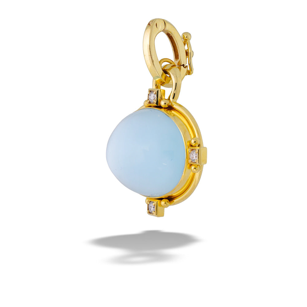 Gold pendant with a light blue gemstone on a white background  Blue Topaz, Mother of Pearl, and Diamond Pendant by Mazza 