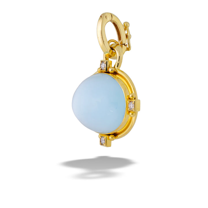 Gold pendant with a light blue gemstone on a white background  Blue Topaz, Mother of Pearl, and Diamond Pendant by Mazza 