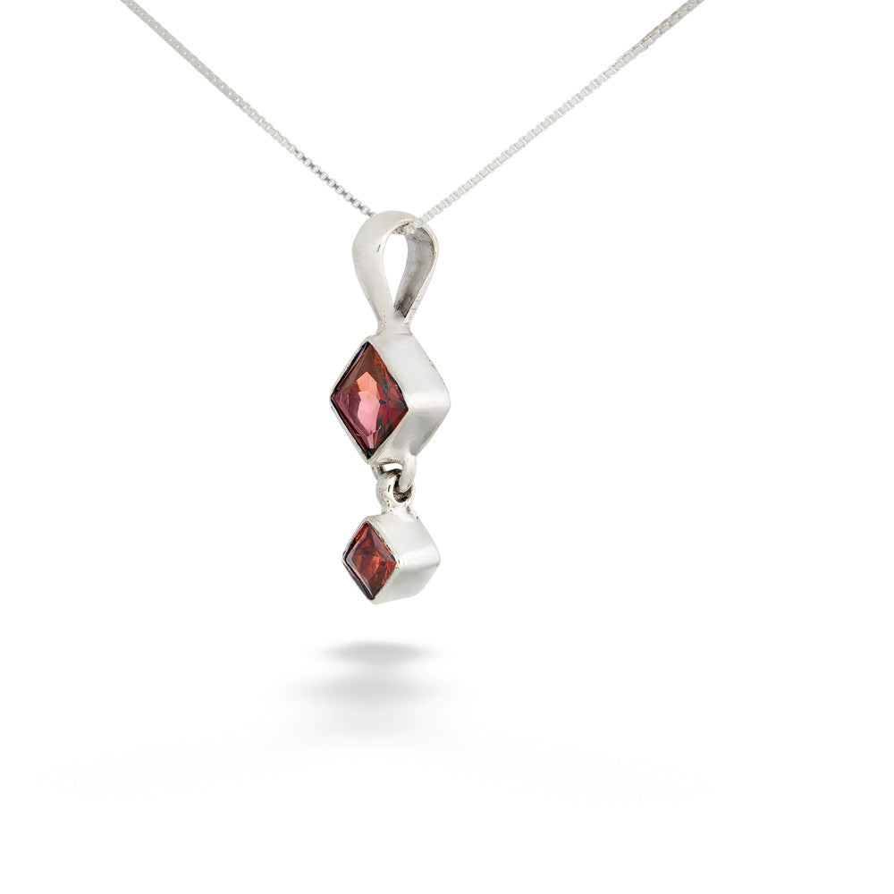 Silver pendant with two red gemstones on a white background Square Garnet Drop Pendant Necklace by Acleoni