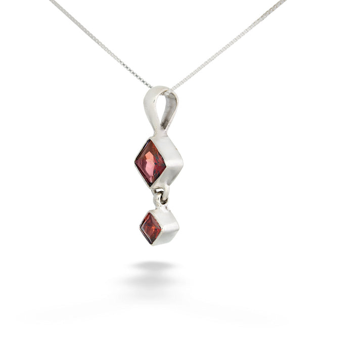 Silver pendant with two red gemstones on a white background Square Garnet Drop Pendant Necklace by Acleoni