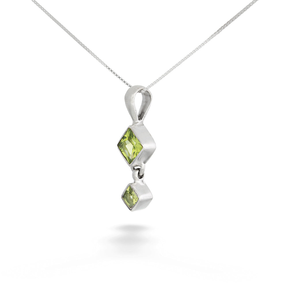 Silver pendant with green gemstones on a white background Square Peridot Drop Pendant Necklace by Acleoni