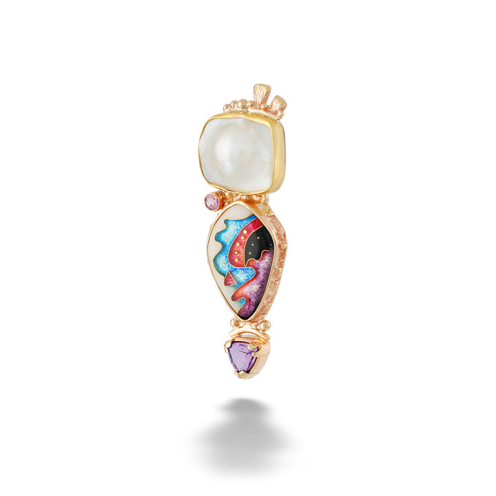 A gold pendant featuring a large white oval stone at the top, a teardrop-shaped center section with colorful abstract enameled details in blue, red, pink, and black, and a small purple heart-shaped stone at the bottom, shown on a white background. Abstract Moondance Pendant by Katrin Wolf