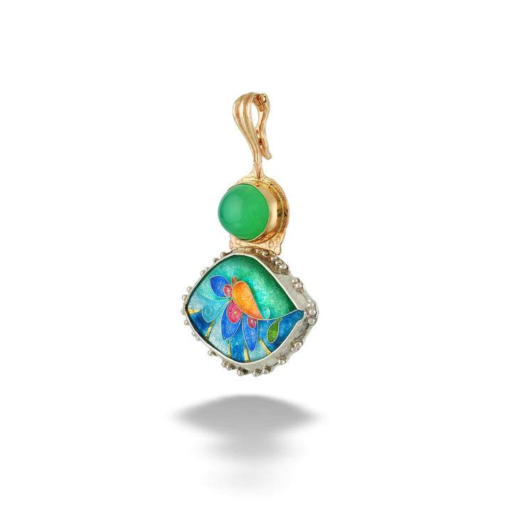 A gold pendant featuring a round green cabochon stone and a larger irregular enamel inlay with blue, green, orange, and yellow floral details, shown on a white background with a soft shadow. Blues Enamel Pendant by Katrin Wolf