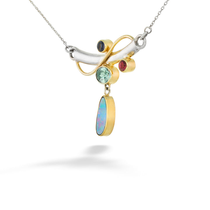 Multicolored gemstone pendant on a silver chain against a white background Multi-Stone Bar Necklace by Michou