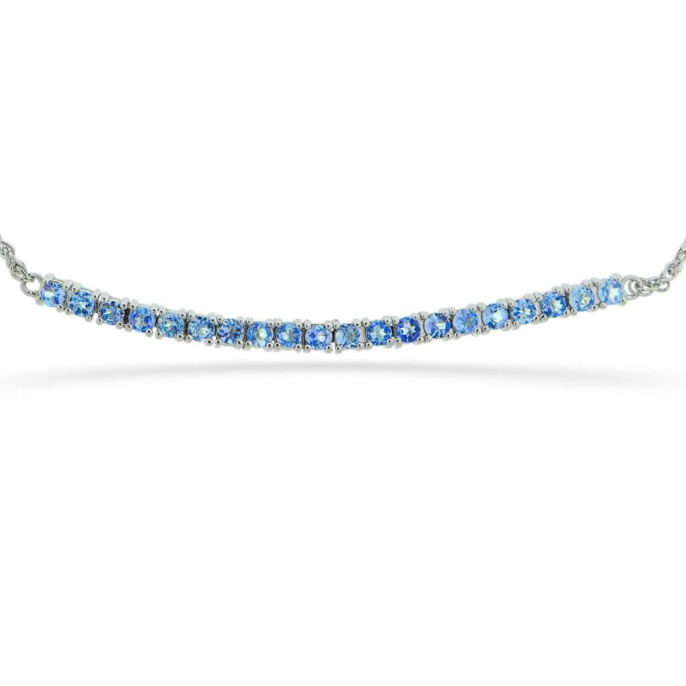 Silver bracelet with blue gemstones on a white background Tanzanite Bar Bracelet by Samuel B.