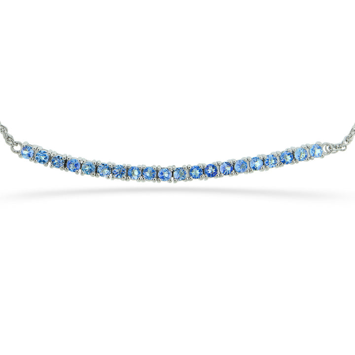 Silver bracelet with blue gemstones on a white background Tanzanite Bar Bracelet by Samuel B.
