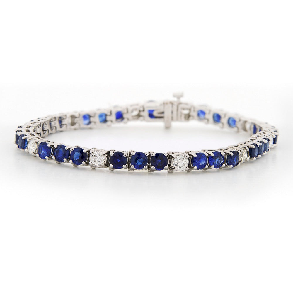 Silver bracelet with blue gemstones on a white background Sapphire and Diamond Bracelet - 7"