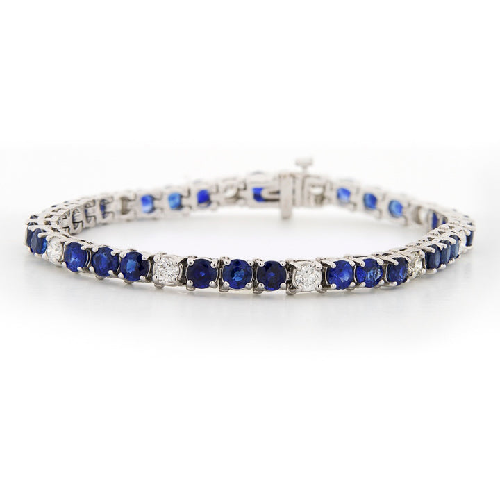 Silver bracelet with blue gemstones on a white background Sapphire and Diamond Bracelet - 7"