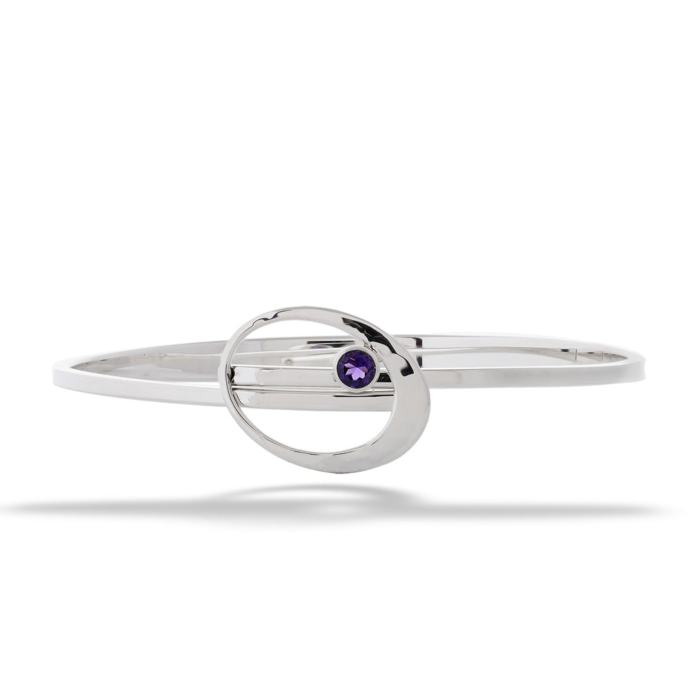 Silver bracelet with a purple gemstone on a white background Amethyst Elliptical Elegance Swing Bracelet by E.L. Designs