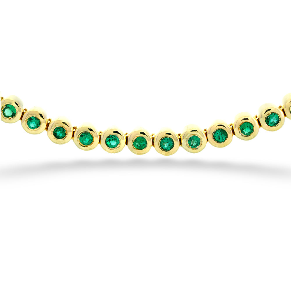 Gold bracelet with green gemstones on a white background Emerald Line Bracelet by Shy Creation