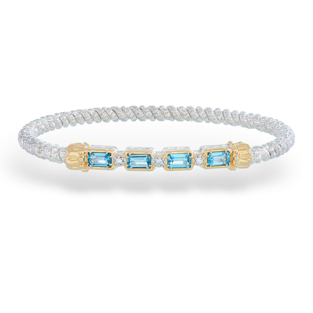 Bracelet with blue gemstones and gold accents on a white background Swiss Blue Topaz and Diamond Bracelet by Vahan