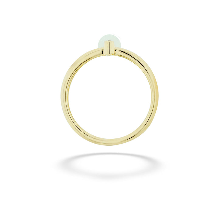Gold ring with a small round gemstone on a white background Pearl and Diamond Ring by Shy Creation